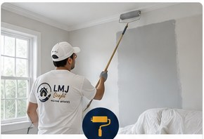 Illustrative painter applying a fresh coat to an interior wall